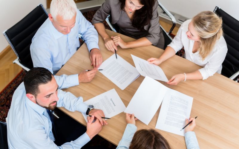 Law firm advisory meeting discussing AML_CTF compliance research support