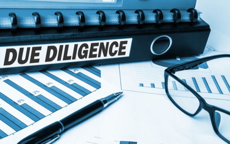 Research analyst reviewing compliance data for AML_CTF due diligence